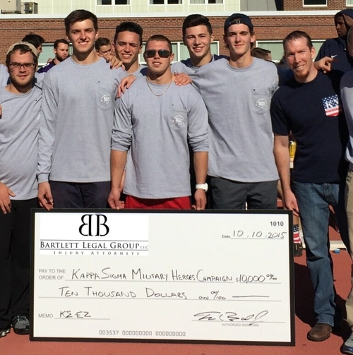 Kappa Sigma receiving $10,000 check from Bartlett Legal Group for Military Heroes Campaign